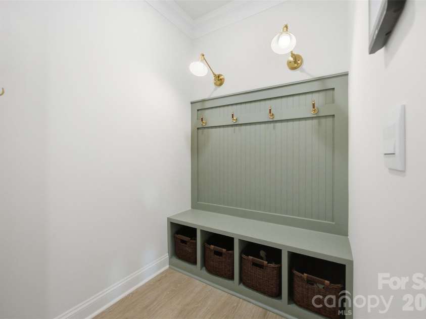 5821 Casper Drive, Charlotte, NC 28214.  MLS# CAR4405553, YatesRealty ID 39797. Mudroom off the garage with functional built-ins.