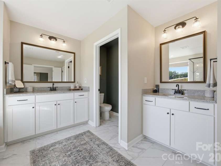 5821 Casper Drive, Charlotte, NC 28214.  MLS# CAR4405553, YatesRealty ID 39797. Separate vanities and water closet.
