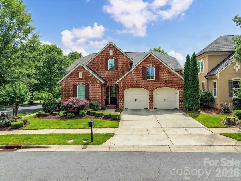 16620 Redding Park Lane, Cornelius, NC 28031.  MLS# CAR4404866, YatesRealty ID 39811. Beautifully maintained full brick home with exceptional curb appeal, a spacious three-car garage, and professionally landscaped grounds in a highly desirable community.