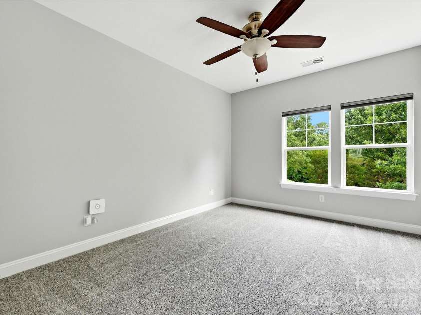 16620 Redding Park Lane, Cornelius, NC 28031.  MLS# CAR4404866, YatesRealty ID 39811. Bright and inviting, the fourth bedroom features large windows, ample closet space, and a versatile layout to fit your lifestyle.