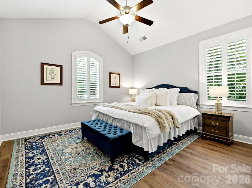 16620 Redding Park Lane, Cornelius, NC 28031.  MLS# CAR4404866, YatesRealty ID 39811. The generously sized secondary bedroom features vaulted ceilings, beautiful natural light, and plenty of room for guests, family, or a private retreat.