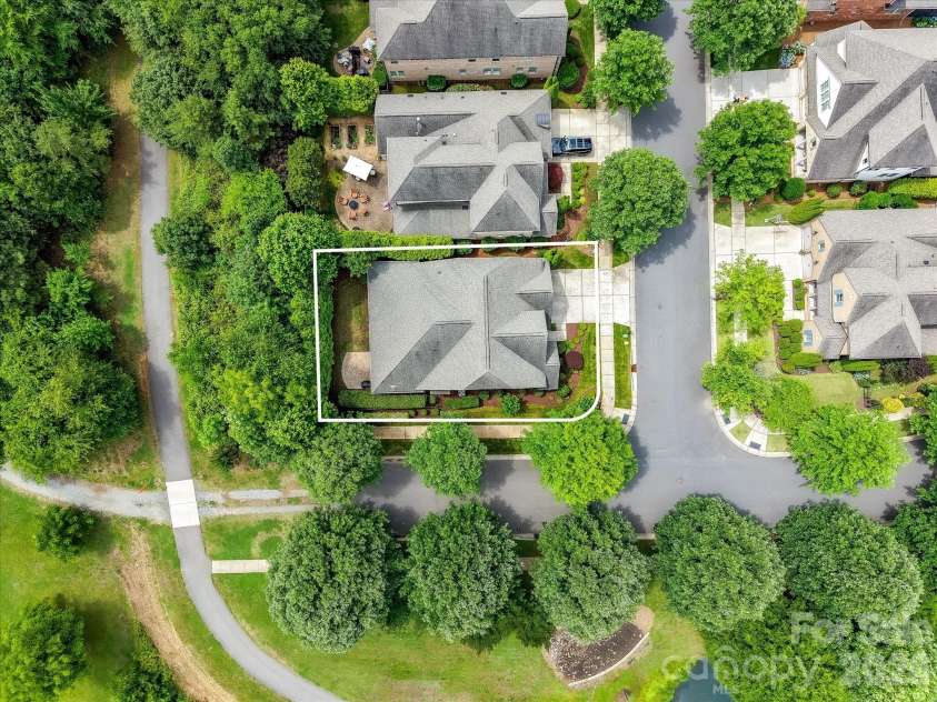 16620 Redding Park Lane, Cornelius, NC 28031.  MLS# CAR4404866, YatesRealty ID 39811. This exceptional homesite backs to scenic walking trails, a tranquil community pond, and lush green space, offering a private setting with beautiful natural surroundings.