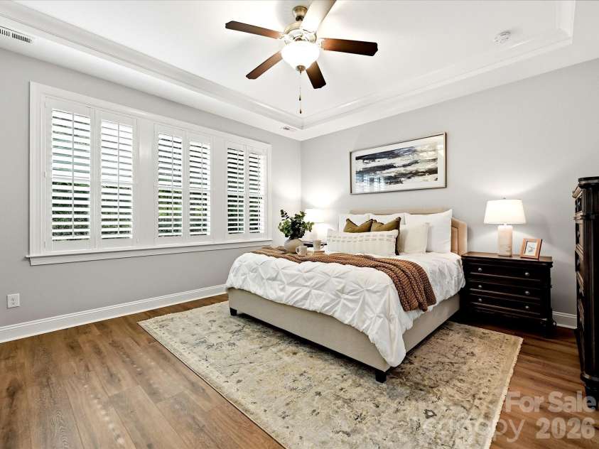 16620 Redding Park Lane, Cornelius, NC 28031.  MLS# CAR4404866, YatesRealty ID 39811. Unwind in the expansive primary suite featuring a tray ceiling, large windows with plantation shutters, and a spa-inspired ensuite bath.