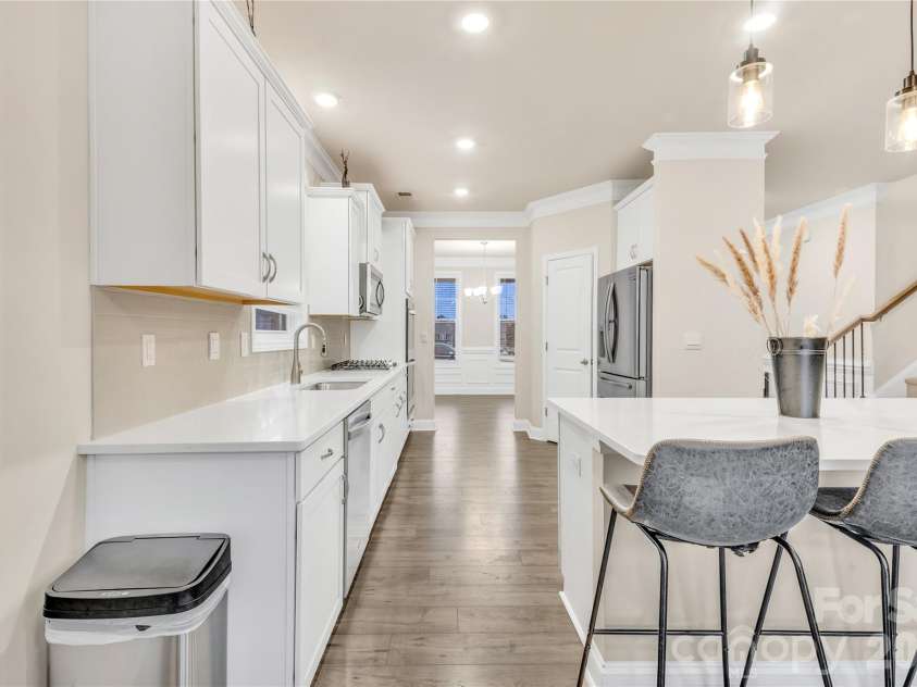 4849 Tacoma Drive, Fort Mill, SC 29707.  MLS# CAR4404585, YatesRealty ID 39813. Gorgeous white kitchen with easy access to dining room.
