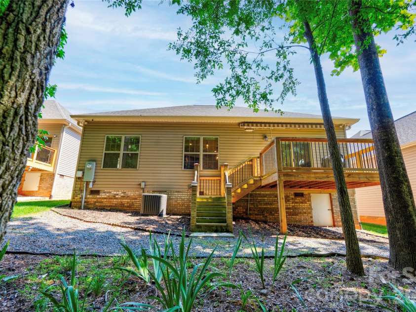 194 T R Harris Drive, Shelby, NC 28150.  MLS# CAR4403041, YatesRealty ID 3984. Backyard has multiple areas for relaxing and the deck has a remote controlled awning and natural gas line for grilling.