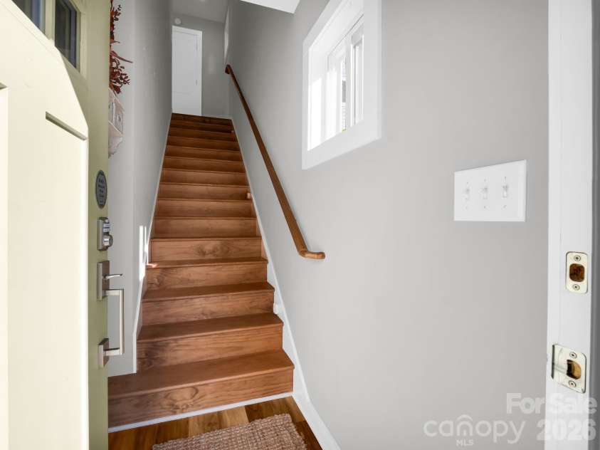 9 Citra Street, Arden, NC 28704.  MLS# CAR4299774, YatesRealty ID 3984. Stairs to main level
