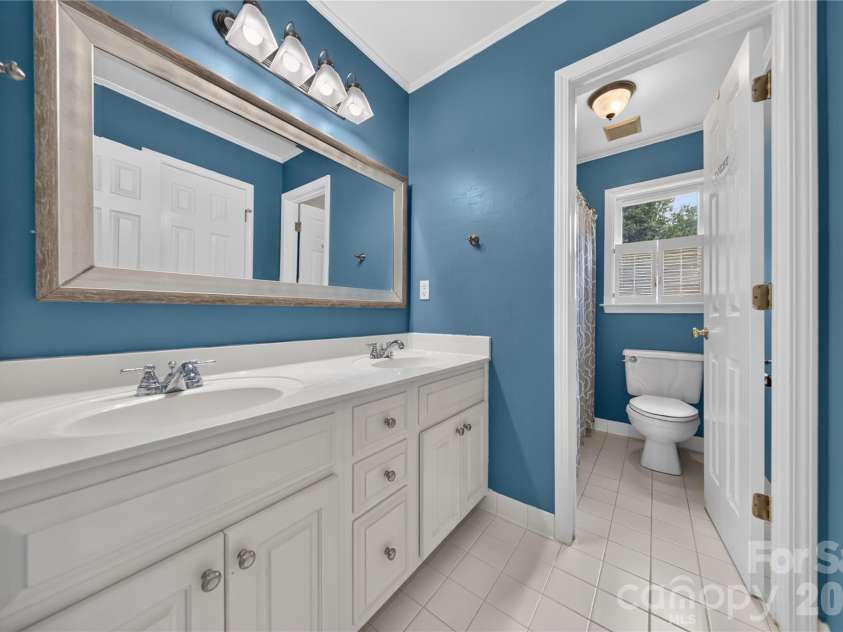 2615 Providence Hills Drive, Matthews, NC 28105.  MLS# CAR4396686, YatesRealty ID 39848. Hall bathroom
