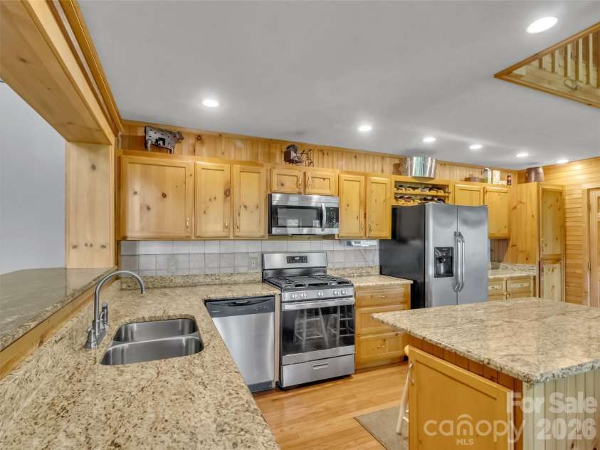 12 Signal Ridge, Sylva, NC 28779.  MLS# CAR4399435, YatesRealty ID 39863. Knotty Pine Cabinets