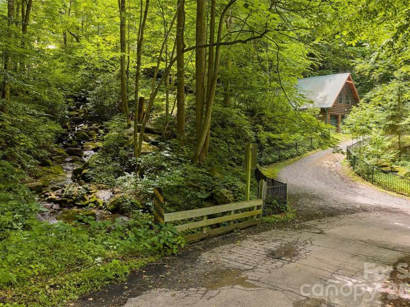 1482 Howard Moore Road, Hot Springs, NC 28743.  MLS# CAR4401313, YatesRealty ID 39864. Rushing creek