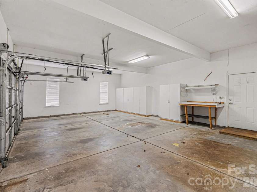 7039 Sedgebrook Drive, Stanley, NC 28164.  MLS# CAR4332906, YatesRealty ID 3987. Garage is 777 sq ft !!! generous two car opening plus a 12x21 ft workshop area. 