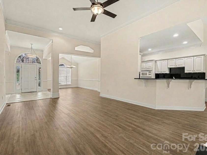 7039 Sedgebrook Drive, Stanley, NC 28164.  MLS# CAR4332906, YatesRealty ID 3987. Open view into dining room