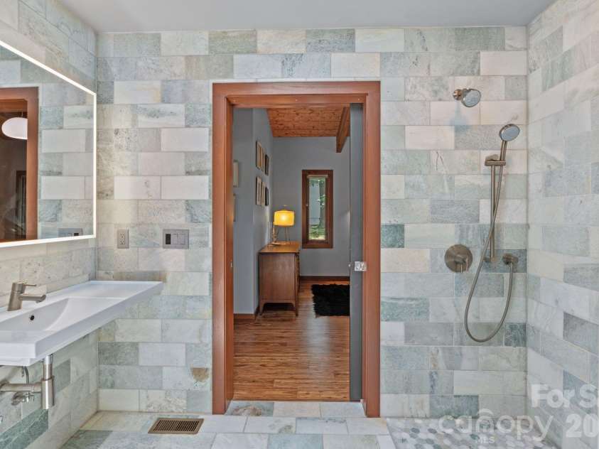 39 Wolf Road, Asheville, NC 28805.  MLS# CAR4397525, YatesRealty ID 39870. Bathroom facing bedroom door