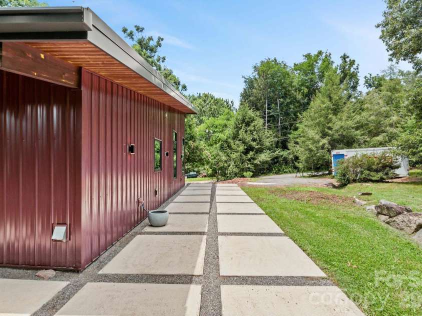 39 Wolf Road, Asheville, NC 28805.  MLS# CAR4397525, YatesRealty ID 39870. Driveway side of house