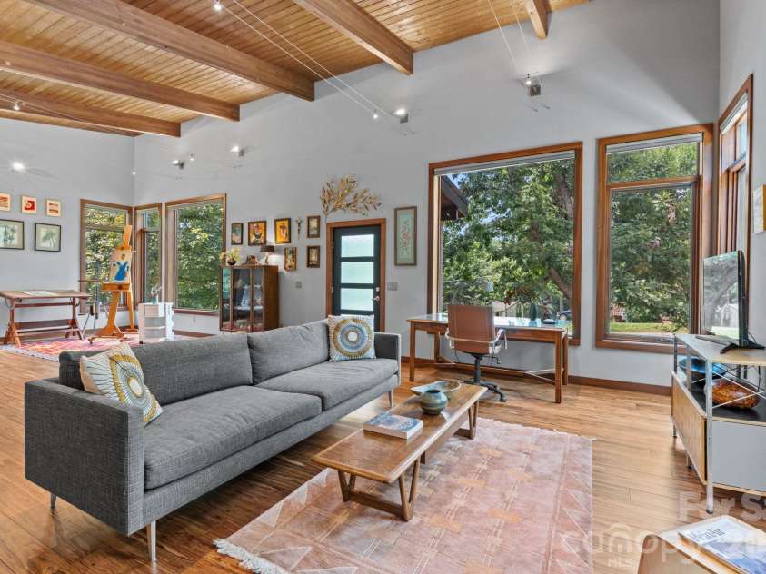 39 Wolf Road, Asheville, NC 28805.  MLS# CAR4397525, YatesRealty ID 39870. Living area and Art Studio facing front door