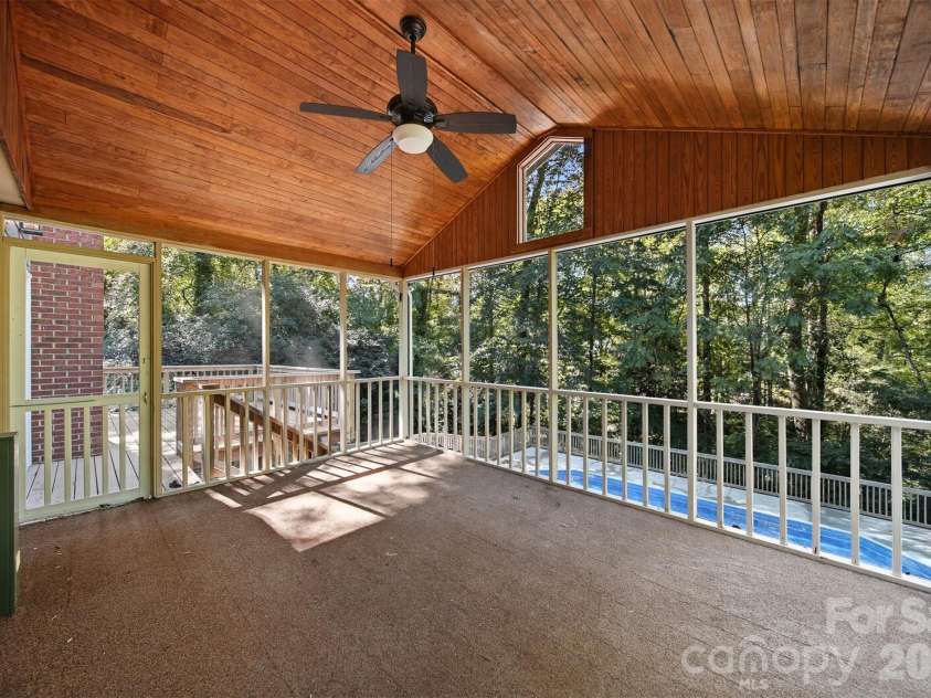 4041 4th Street Court, Hickory, NC 28601.  MLS# CAR4340977, YatesRealty ID 3988. Lovely Screened in porch overlooking the private back yard and pool.