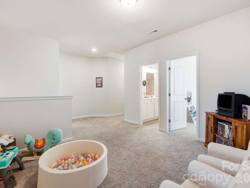 6023 Busch Way, Midland, NC 28107.  MLS# CAR4397614, YatesRealty ID 39883. Additional loft view showing the generous amount of usable space.