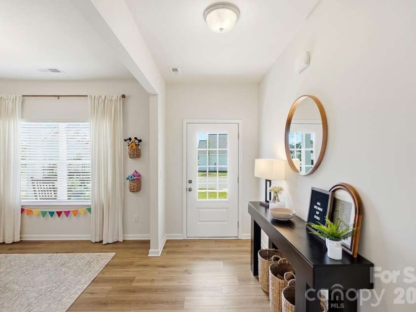 6023 Busch Way, Midland, NC 28107.  MLS# CAR4397614, YatesRealty ID 39883. Additional view of the bright and flexible front room.