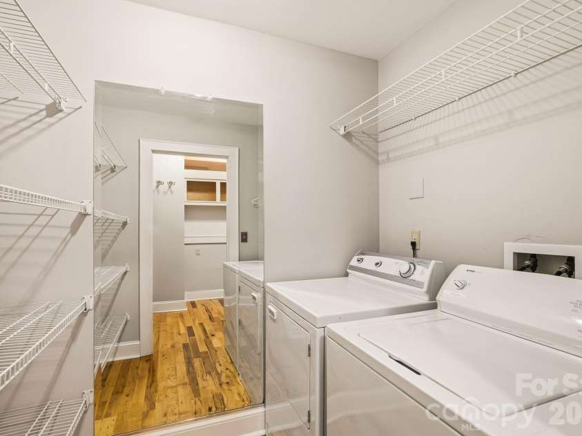 60 Haywood Street, Asheville, NC 28801.  MLS# CAR4317577, YatesRealty ID 39889. Convenient Laundry