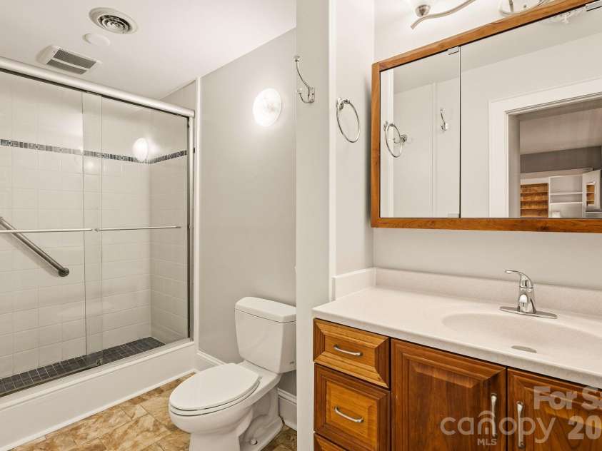60 Haywood Street, Asheville, NC 28801.  MLS# CAR4317577, YatesRealty ID 39889. Main Bathroom with Step-in Shower