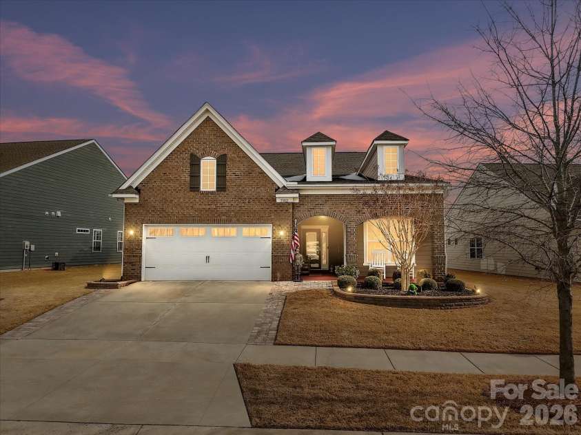 3302 Oliver Stanley Trail, Lancaster, SC 29720.  MLS# CAR4340248, YatesRealty ID 3989. Twilight View of 1.5 Story Beacon Plan with Brick Front and Fiber Cement Sides. 