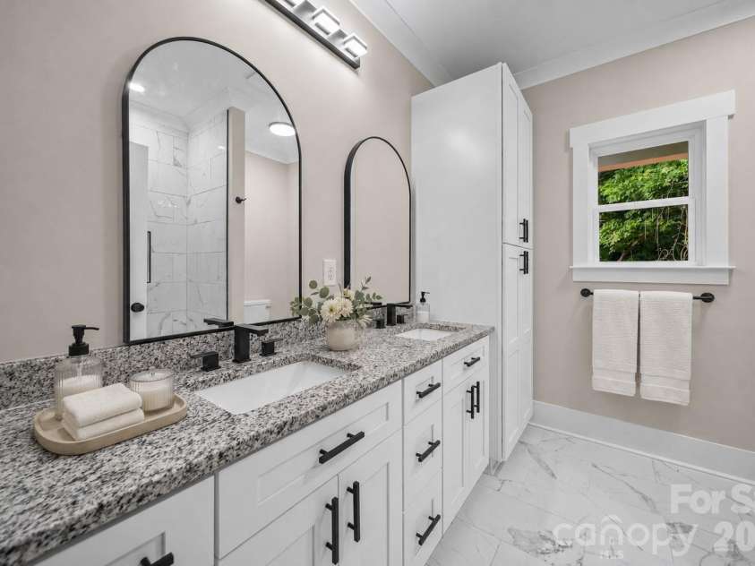 1835 Kingsley Drive, Albemarle, NC 28001.  MLS# CAR4406751, YatesRealty ID 39907. Virtually staged. Primary bathroom with custom built in storage