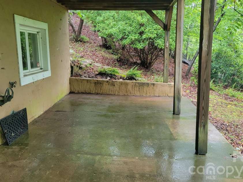 430 Laurel Heights Lane, Tryon, NC 28782.  MLS# CAR4277530, YatesRealty ID 3991. Basement porch