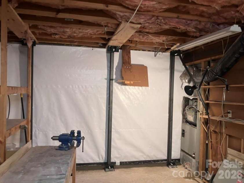 430 Laurel Heights Lane, Tryon, NC 28782.  MLS# CAR4277530, YatesRealty ID 3991. Completed repair to basement wall