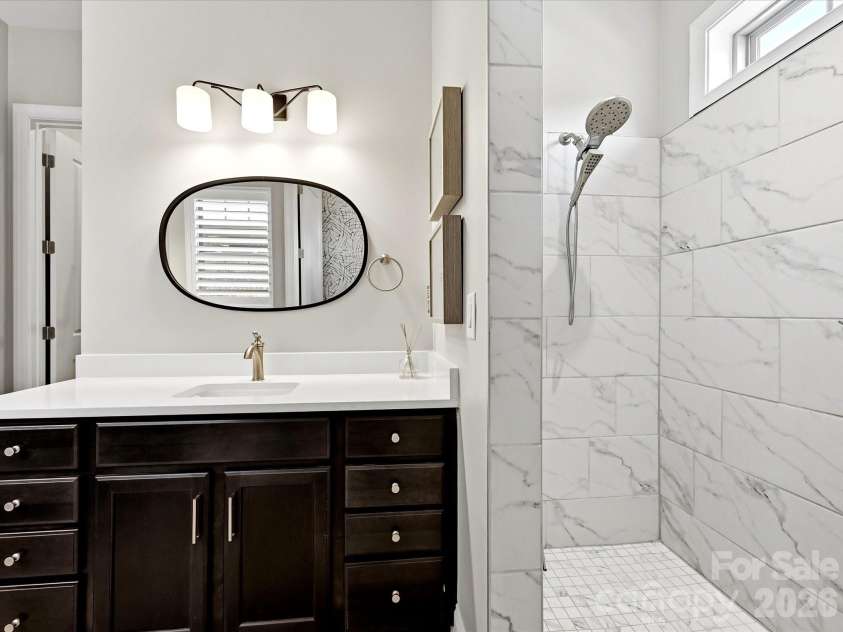 5008 Vita Way, Belmont, NC 28012.  MLS# CAR4406973, YatesRealty ID 39925. Primary bath features a zero entry roll in shower