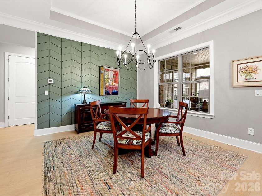 5008 Vita Way, Belmont, NC 28012.  MLS# CAR4406973, YatesRealty ID 39925. Stunning custom wood feature wall instantly transforms this space into a warm and elegant dining room