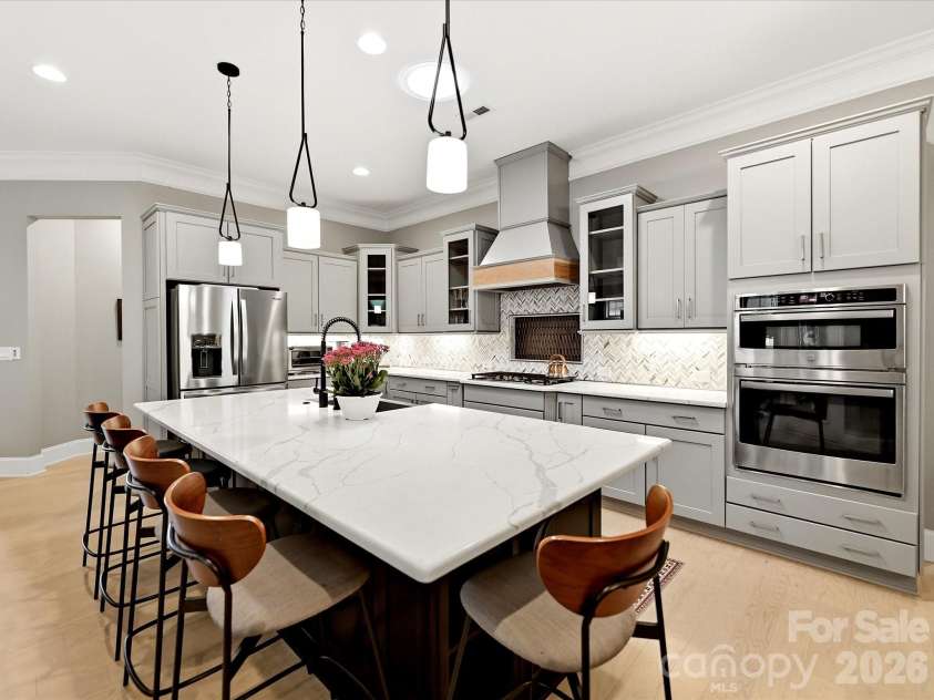 5008 Vita Way, Belmont, NC 28012.  MLS# CAR4406973, YatesRealty ID 39925. This exquisite kitchen features quartz and a well appointed space that's perfect for both everyday living and effortless entertaining.