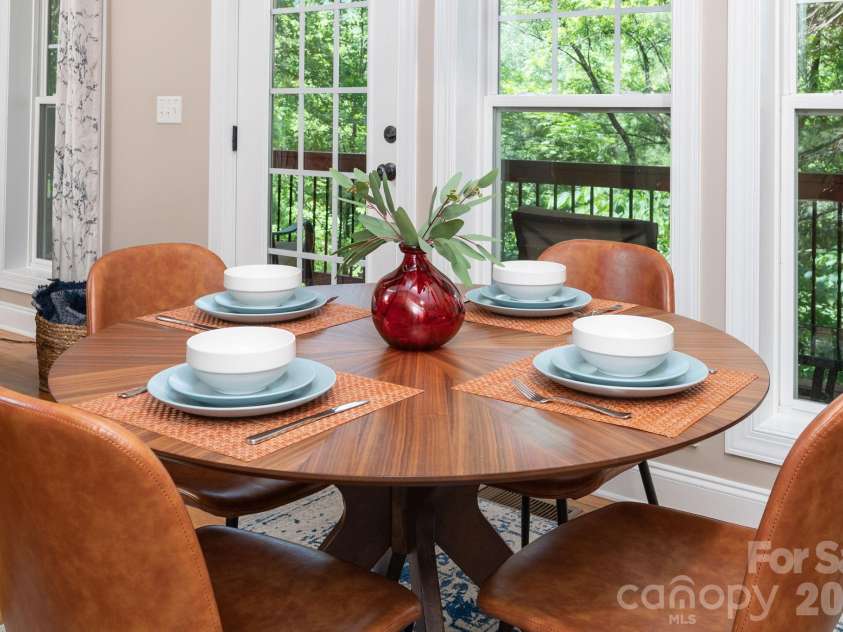 15 Happy Crow Lane, Asheville, NC 28805.  MLS# CAR4403766, YatesRealty ID 39930. Table for four...