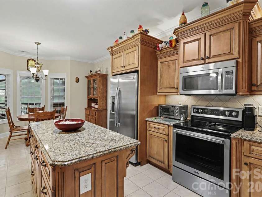 119 Blakemore Drive, Shelby, NC 28152.  MLS# CAR4404874, YatesRealty ID 39934. The updated, open kitchen features great flow, an island with storage and electrical outlet, granite countertops, stainless steel appliances,...
