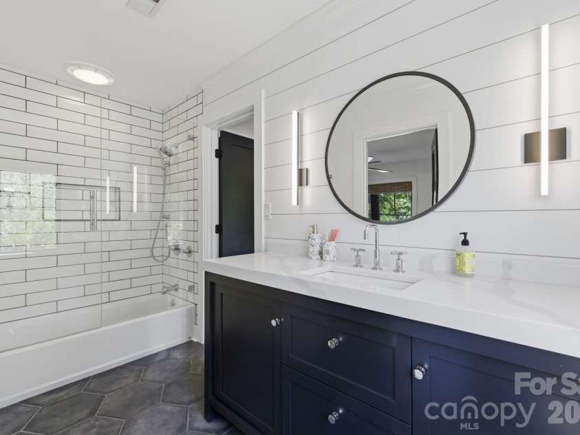 19624 Meta Road, Cornelius, NC 28031.  MLS# CAR4394341, YatesRealty ID 39952. Upper bath features a walk in shower for a spa-inspired experience. Updated finishes create a fresh, luxurious feel.