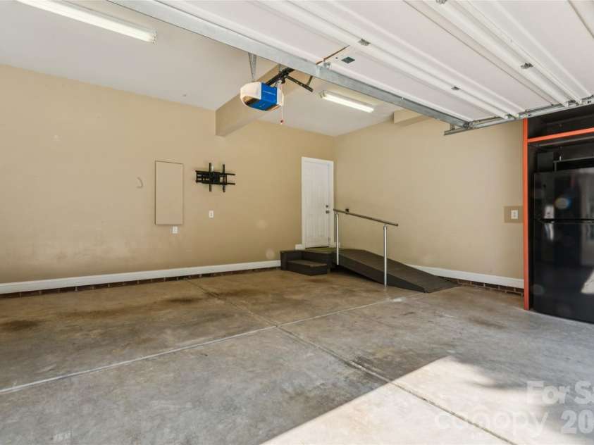 9727 Devonshire Drive, Huntersville, NC 28078.  MLS# CAR4398845, YatesRealty ID 39956. 2-car Garage with storage cabinets.