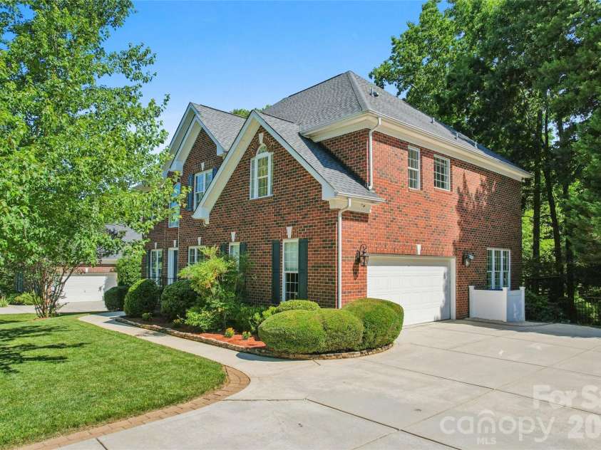 9727 Devonshire Drive, Huntersville, NC 28078.  MLS# CAR4398845, YatesRealty ID 39956. Exterior Front with side garage entrance.