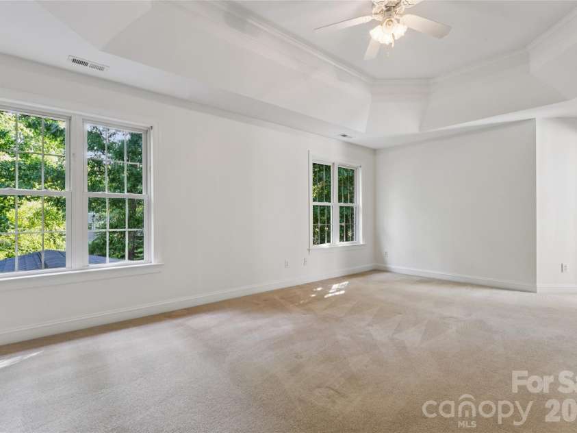 9727 Devonshire Drive, Huntersville, NC 28078.  MLS# CAR4398845, YatesRealty ID 39956. Large Primary Bedroom with double tray ceiling.