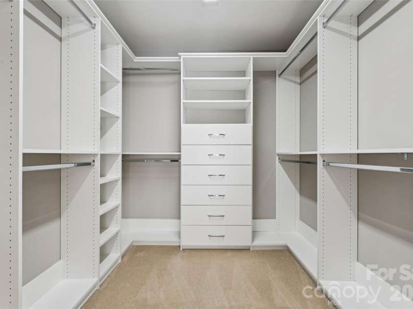 9727 Devonshire Drive, Huntersville, NC 28078.  MLS# CAR4398845, YatesRealty ID 39956. Primary bedroom walk-in closets with built-ins.