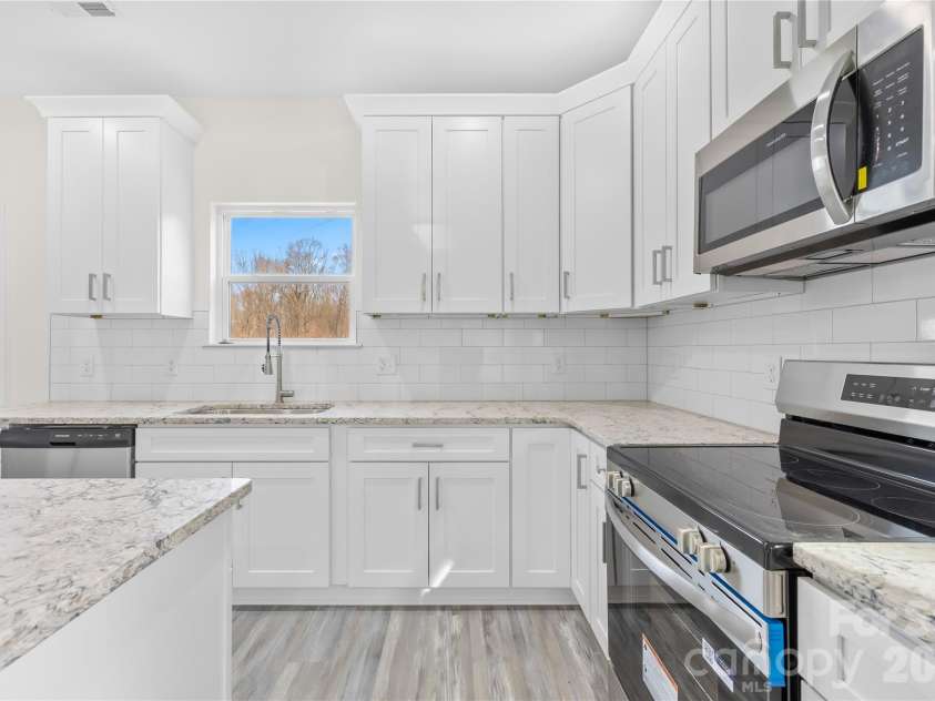 115 Railroad Avenue, East Spencer, NC 28039.  MLS# CAR4394930, YatesRealty ID 39961. Kitchen Appliances angle