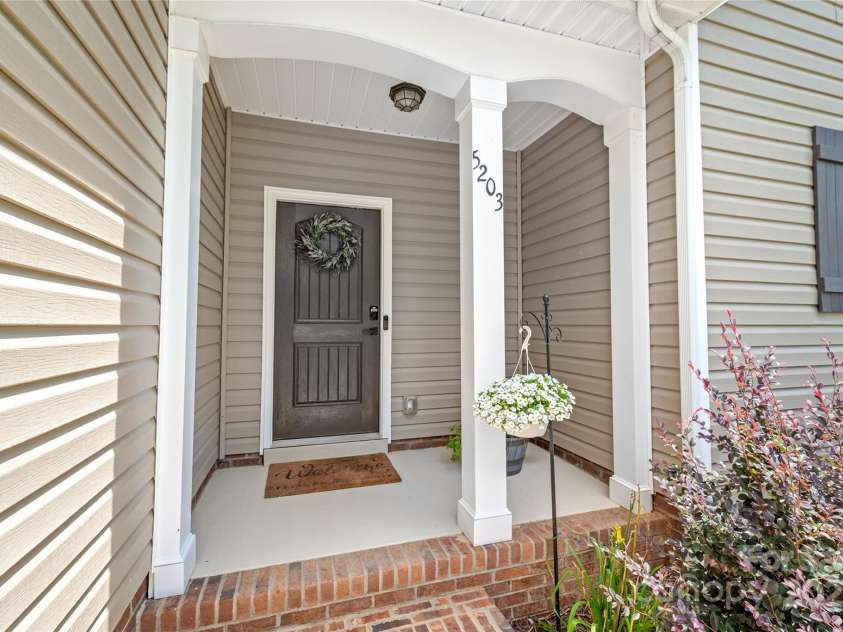 5203 Lawyers Road, Wingate, NC 28174.  MLS# CAR4281064, YatesRealty ID 39962. Entry, entry path concrete sealled.