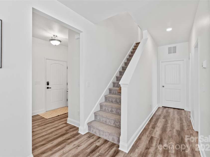 5203 Lawyers Road, Wingate, NC 28174.  MLS# CAR4281064, YatesRealty ID 39962. Second floor stairs
