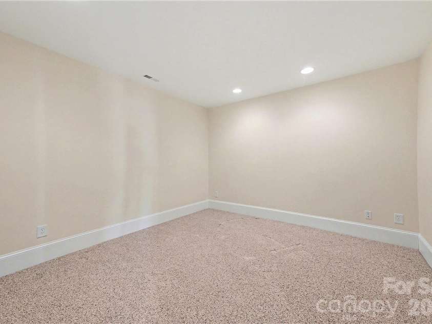 4526 Island Waters Drive, Denver, NC 28037.  MLS# CAR4341162, YatesRealty ID 3997. Lower level home theater room