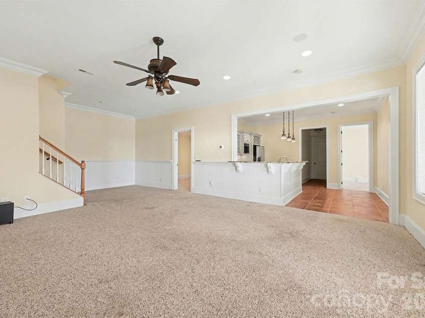 4526 Island Waters Drive, Denver, NC 28037.  MLS# CAR4341162, YatesRealty ID 3997. Lower level living room into kitchen