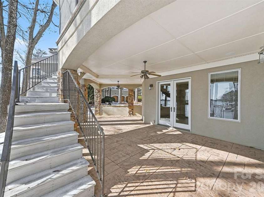 4526 Island Waters Drive, Denver, NC 28037.  MLS# CAR4341162, YatesRealty ID 3997. Lower level patio walk-out with steps to main level screened-in porch