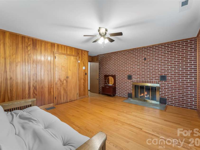 8647 US 221 Highway, Marion, NC 28752.  MLS# CAR4407828, YatesRealty ID 39972. Bedroom with fireplace