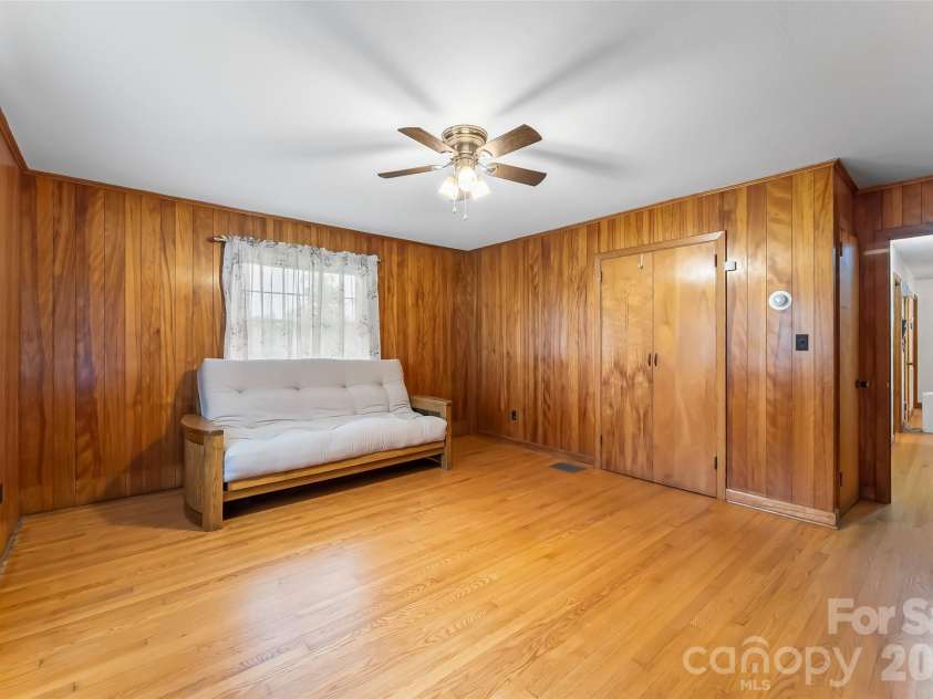 8647 US 221 Highway, Marion, NC 28752.  MLS# CAR4407828, YatesRealty ID 39972. Bedroom with fireplace
