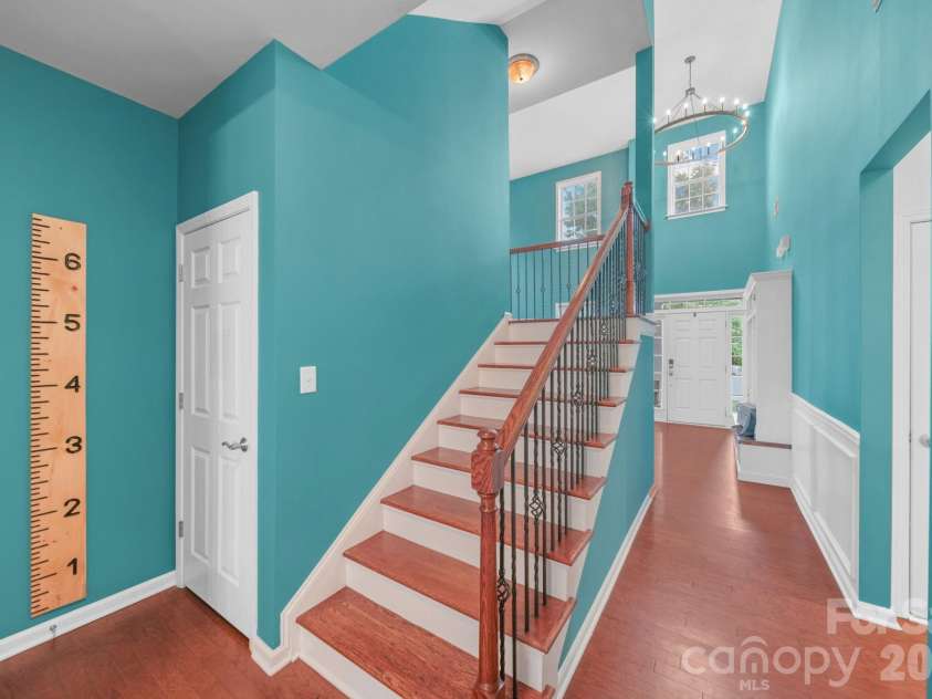 10906 Trout Creek Place, Davidson, NC 28036.  MLS# CAR4407543, YatesRealty ID 39976. Downstairs Staircase