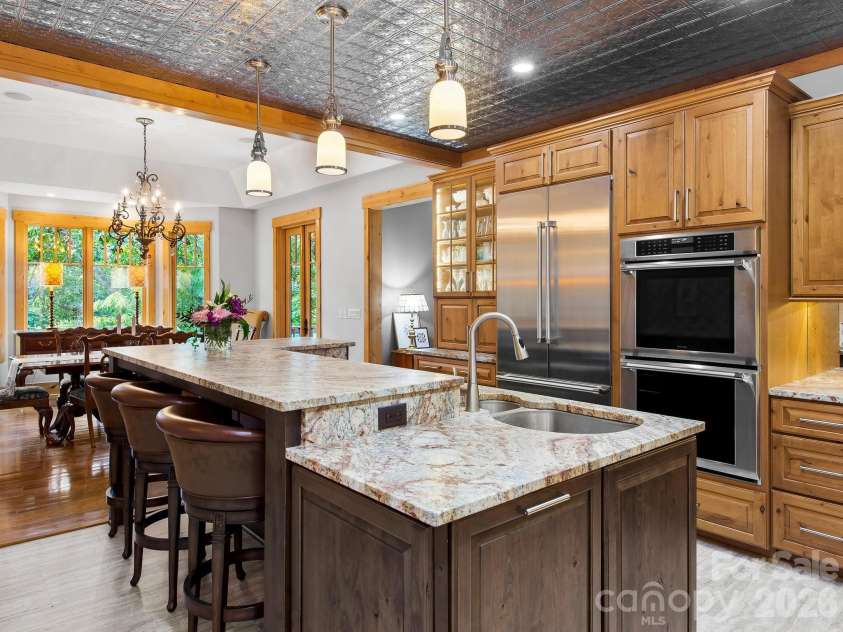 600 White Water Way, Marshall, NC 28753.  MLS# CAR4403673, YatesRealty ID 39990. Knotty alder cabinets with granite countertops.
