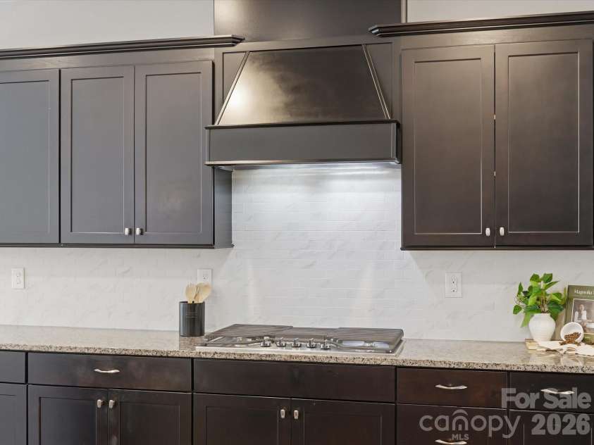 5353 Baker Lane, Clover, SC 29710.  MLS# CAR4401671, YatesRealty ID 39994. Kitchen range and sleek modern hood