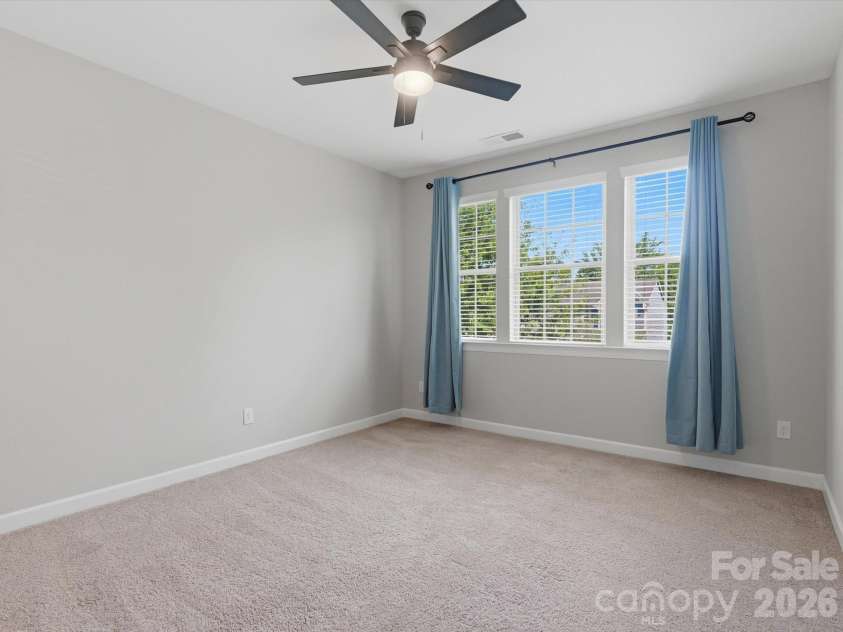5353 Baker Lane, Clover, SC 29710.  MLS# CAR4401671, YatesRealty ID 39994. Large bonus room featuring ample space for entertainment.