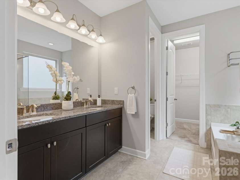 5353 Baker Lane, Clover, SC 29710.  MLS# CAR4401671, YatesRealty ID 39994. Large primary bathroom featuring a spacious layout, high-end finishes, and ample natural light.
